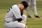 MINNEAPOLIS, MN - OCTOBER 11: Pitcher Phil Hughes #65 of the New York Yankees kneels at the mound before his first throw against the Minnesota Twins in Game Three of the ALDS during the 2009 MLB Playoffs at the Hubert H. Humphrey Metrodome on October 11, 2009 in Minneapolis, Minnesota. (Photo by Genevieve Ross/Getty Images)