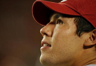 FORT LAUDERDALE, FL - OCTOBER 03: Injured quarterback Sam Bradford #14 of the Oklahoma Sooners looks up to the scoreboard late in the game against the Miami Hurricanes at Land Shark Stadium on October 3, 2009 in Fort Lauderdale, Florida. Miami defeated Oklahoma 21-20. (Photo by Doug Benc/Getty Images)