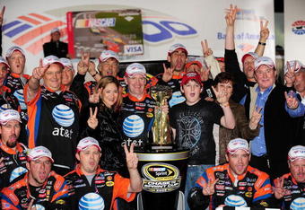 CONCORD, NC - OCTOBER 11:  Jeff Burton, driver of the #31 AT&T Mobility Chevrolet, and the AT&T Mobility team celebrate in victory lane after winning the NASCAR Sprint Cup Series Bank of America 500 at Lowe's Motor Speedway on October 11, 2008 in Concord, North Carolina.  (Photo by Rusty Jarrett/Getty Images for NASCAR)