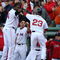 BOSTON - OCTOBER 11:  Joey Gathright #23 of the Boston Red Sox is celebrates with teammate David Ortiz #34 after scoring on a RBI single by Mike Lowell #25 in the eighth inning of Game Three of the ALDS against the Los Angeles Angels of Anaheim during the 2009 MLB Playoffs at Fenway Park on October 11, 2009 in Boston, Massachusetts. (Photo by Elsa/Getty Images)