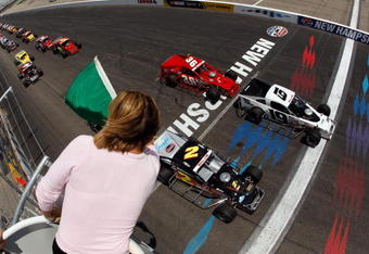 LOUDON, NH - JUNE 27:  Doug Coby, driver of the #19 Major Motion Transportation Chevrolet, takes the green flag to start the NASCAR Whelen Modified Tour New England 100 at New Hampshire Motor Speedway on June 27, 2009 in Loudon, New Hampshire.  (Photo by Chris Graythen/Getty Images for NASCAR)