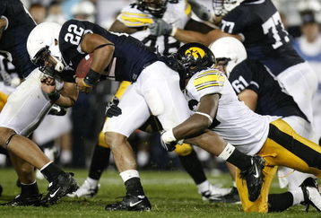 STATE COLLEGE, PA - SEPTEMBER 26:  Evan Royster #22 of the Penn State Nittnay Lions is tackled by Jeremiha Hunter #42 of the Iowa Hawkeye's on September 26, 2009 at Beaver Stadium in State College, Pennsylvania. (Photo by Gregory Shamus/Getty Images)