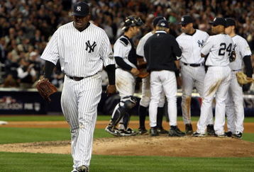 NEW YORK - OCTOBER 07: Starting pitcher CC Sabathia #52 of the New York Yankees walks to the dugout after being pulled out of the game in the seventh inning against the Minnesota Twins in Game One of the ALDS during the 2009 MLB Playoffs at Yankee Stadium on October 7, 2009 in the Bronx borough of New York City. (Photo by Jim McIsaac/Getty Images) 