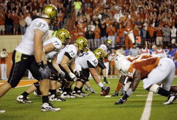 AUSTIN, TX - OCTOBER 10:  Center Keenan Stevens #56 of the Colorado Buffaloes prepares to snap the ball against the Texas Longhorns on October 10, 2009 at Darrell K Royal-Texas Memorial Stadium in Austin, Texas.  Texas won 38-14.  (Photo by Brian Bahr/Getty Images)