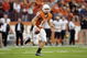 AUSTIN, TX - OCTOBER 10:  Quarterback Colt McCoy #12 of the Texas Longhorns looks for a receiver against the Colorado Buffaloes on October 10, 2009 at Darrell K Royal-Texas Memorial Stadium in Austin, Texas.  Texas won 38-14.  (Photo by Brian Bahr/Getty Images)