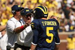 ANN ARBOR, MI - SEPTEMBER 19:  Head coach Rich Rodriguez of the Michigan Wolverines talks with quarterback Tate Forcier #5 during the game with the Eastern Michigan Eagles at Michigan Stadium on September 19, 2009 in Ann Arbor, Michigan.  Michigan won 45-17.  (Photo by Stephen Dunn/Getty Images)