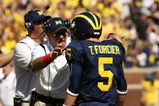 ANN ARBOR, MI - SEPTEMBER 19:  Head coach Rich Rodriguez of the Michigan Wolverines talks with quarterback Tate Forcier #5 during the game with the Eastern Michigan Eagles at Michigan Stadium on September 19, 2009 in Ann Arbor, Michigan.  Michigan won 45-17.  (Photo by Stephen Dunn/Getty Images)