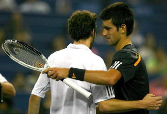 SHANGHAI, CHINA - OCTOBER 16:  Gilles Simon of France congratulates Novak Djokovic of Serbia after their match during day six of the 2009 Shanghai ATP Masters 1000 at Qi Zhong Tennis Centre on October 16, 2009 in Shanghai, China.  (Photo by Matthew Stockman/Getty Images)