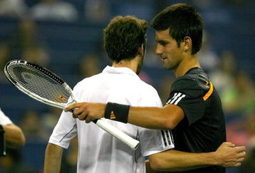 SHANGHAI, CHINA - OCTOBER 16:  Gilles Simon of France congratulates Novak Djokovic of Serbia after their match during day six of the 2009 Shanghai ATP Masters 1000 at Qi Zhong Tennis Centre on October 16, 2009 in Shanghai, China.  (Photo by Matthew Stockman/Getty Images)