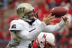 LINCOLN, NE - SEPTEMBER 17:  Quarterback Tyler Palko #3 of the Pittsburgh Panthers loses control of the ball as he is hit by defensive end Adam Carriker #90 of the Nebraska Cornhuskers on September 17, 2005 at Memorial Stadium in Lincoln, Nebraska. The play was ruled an incomplete pass, and Nebraska won 7-6.  (Photo by Brian Bahr/Getty Images)