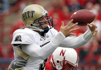 LINCOLN, NE - SEPTEMBER 17:  Quarterback Tyler Palko #3 of the Pittsburgh Panthers loses control of the ball as he is hit by defensive end Adam Carriker #90 of the Nebraska Cornhuskers on September 17, 2005 at Memorial Stadium in Lincoln, Nebraska. The play was ruled an incomplete pass, and Nebraska won 7-6.  (Photo by Brian Bahr/Getty Images)