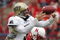 LINCOLN, NE - SEPTEMBER 17:  Quarterback Tyler Palko #3 of the Pittsburgh Panthers loses control of the ball as he is hit by defensive end Adam Carriker #90 of the Nebraska Cornhuskers on September 17, 2005 at Memorial Stadium in Lincoln, Nebraska. The play was ruled an incomplete pass, and Nebraska won 7-6.  (Photo by Brian Bahr/Getty Images)