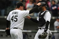 CHICAGO - APRIL 29:  Bobby Jenks #45 of the Chicago White Sox congratulates teammate A.J. Pierzynski #12 after a win against the Seattle Mariners on April 29, 2009 at U.S. Cellular Field in Chicago, Illinois. The White Sox defeated the Mariners 6-3. (Photo by Jonathan Daniel/Getty Images)