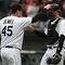 CHICAGO - APRIL 29:  Bobby Jenks #45 of the Chicago White Sox congratulates teammate A.J. Pierzynski #12 after a win against the Seattle Mariners on April 29, 2009 at U.S. Cellular Field in Chicago, Illinois. The White Sox defeated the Mariners 6-3. (Photo by Jonathan Daniel/Getty Images)