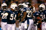SAN DIEGO - DECEMBER 28:  (L-R) Stephen Cooper #54, Antoine Cason #20 and Antonio Cromartie #31 of the San Diego Chargers congratulate teammate Paul Oliver #27 after Oliver intercepted a pass against the Denver Broncos during the second quarter of the NFL game at Qualcomm Stadium on December 28, 2008 in San Diego, California. The Chargers defeated the Broncos 52--21. (Photo by Jeff Gross/Getty Images)