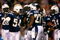 SAN DIEGO - DECEMBER 28:  (L-R) Stephen Cooper #54, Antoine Cason #20 and Antonio Cromartie #31 of the San Diego Chargers congratulate teammate Paul Oliver #27 after Oliver intercepted a pass against the Denver Broncos during the second quarter of the NFL game at Qualcomm Stadium on December 28, 2008 in San Diego, California. The Chargers defeated the Broncos 52--21. (Photo by Jeff Gross/Getty Images)