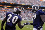 MIAMI, FL - JANUARY 4:  Safety Ed Reed #20 of the Baltimore Ravens celebrates an interception with defensive tackle Trevor Price #90  against the Miami Dolphins in an NFL Wildcard Playoff Game at Dolphins Stadium on January 4, 2009 in Miami, Floirda.  Reed ran for a touchdown with the interception. (Photo by Al Messerschmidt/Getty Images) 