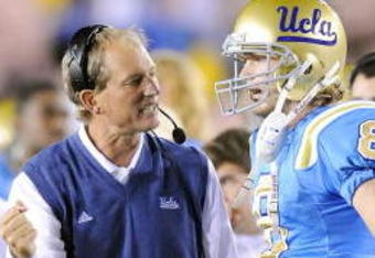 PASADENA, CA - NOVEMBER 08:  Head coach Rick Neuheisel talks with Chris Forcier #8 of the UCLA Bruins during the game against the Oregon State Beavers at the Pasadena Rose Bowl on November 8, 2008 in Pasadena, California.  (Photo by Lisa Blumenfeld/Getty Images)