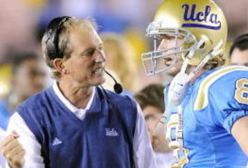 PASADENA, CA - NOVEMBER 08:  Head coach Rick Neuheisel talks with Chris Forcier #8 of the UCLA Bruins during the game against the Oregon State Beavers at the Pasadena Rose Bowl on November 8, 2008 in Pasadena, California.  (Photo by Lisa Blumenfeld/Getty Images)