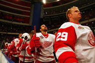 STOCKHOLM, SWEDEN - OCTOBER 03:  #40 Henrik Zetterberg of Detroit Red Wings looks on during the Swedish and United States national anthems during the 2009 Compuware NHL Premiere Stockholm match between St. Louis Blues and Detroit Red Wings at the Ericsson Globe on October 3, 2009 in Stockholm, Sweden.  (Photo by Paul Gilham/Getty Images)