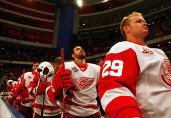 STOCKHOLM, SWEDEN - OCTOBER 03:  #40 Henrik Zetterberg of Detroit Red Wings looks on during the Swedish and United States national anthems during the 2009 Compuware NHL Premiere Stockholm match between St. Louis Blues and Detroit Red Wings at the Ericsson Globe on October 3, 2009 in Stockholm, Sweden.  (Photo by Paul Gilham/Getty Images)