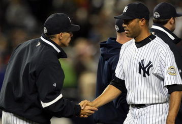 NEW YORK - SEPTEMBER 26:  Mariano Rivera #42 of the New York Yankees shakes hands with manager Joe Girardi after defeating the Boston Red Sox on September 26, 2009 at Yankee Stadium in the Bronx borough of New York City.  (Photo by Jim McIsaac/Getty Images)