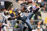 SEATTLE - OCTOBER 21:  Wide receiver Nate Burleson #81 of the Seattle Seahawks leaps for a pass that fell incomplete against Ron Bartell #24 and Oshiomogho Atogwe #21 of the St. Louis Rams at Qwest Field October 21, 2007 in Seattle, Washington. The Seahawks defeated the Rams 33-6. (Photo by Otto Greule Jr/Getty Images)