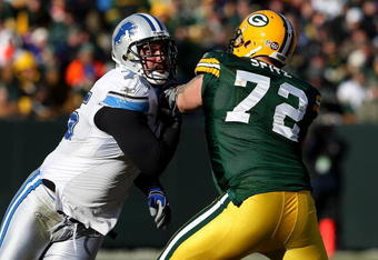 GREEN BAY, WI - DECEMBER 28: Shaun Cody #75 of the Detroit Lions rushes against Jason Spitz #72 of the Green Bay Packers on December 28, 2008 at Lambeau Field in Green Bay, Wisconsin. The Packers defeated the Lions 31-21. (Photo by Jonathan Daniel/Getty Images)