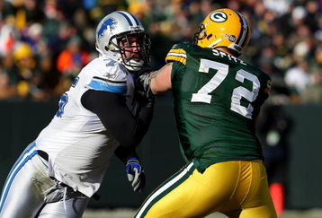 GREEN BAY, WI - DECEMBER 28: Shaun Cody #75 of the Detroit Lions rushes against Jason Spitz #72 of the Green Bay Packers on December 28, 2008 at Lambeau Field in Green Bay, Wisconsin. The Packers defeated the Lions 31-21. (Photo by Jonathan Daniel/Getty Images)