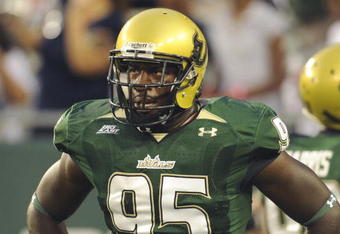 TAMPA, FL - SEPTEMBER 12: Defensive end George Selvie #95 of the University of South Florida Bulls watches play against the Kansas University Jayhawks at Raymond James Stadium on September 12, 2008 in Tampa, Florida.  (Photo by Al Messerschmidt/Getty Images) 