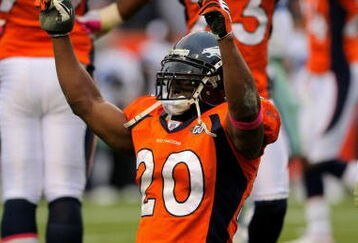 DENVER - OCTOBER 04:  Brian Dawkins #20 and Renaldo Hill #23 of the Denver Broncos celebrate after the Dallas Cowboys on fourth down with :01 second remaining in the game during NFL action at Invesco Field at Mile High on October 4, 2009 in Denver, Colorado. The Broncos defeated the Cowboys 17-10.  (Photo by Doug Pensinger/Getty Images)