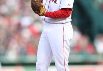 BOSTON - OCTOBER 11:  Pitcher Jonathan Papelbon #58 of the Boston Red Sox prepares to pitch against the Los Angeles Angels of Anaheim in the eighth inning of Game Three of the ALDS during the 2009 MLB Playoffs at Fenway Park on October 11, 2009 in Boston, Massachusetts. (Photo by Elsa/Getty Images)