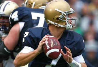 SOUTH BEND, IN - OCTOBER 03: Jimmy Clausen #7 of the Notre Dame Fighting Irish looks for a receiver against the Washington Huskies on October 3, 2009 at Notre Dame Stadium in South Bend, Indiana. Notre Dame defeated Washington 37-30 in overtime. (Photo by Jonathan Daniel/Getty Images)