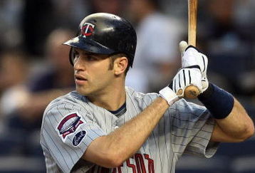 NEW YORK - OCTOBER 09:  Joe Mauer #7 of the Minnesota Twins bats against the New York Yankees in Game Two of the ALDS during the 2009 MLB Playoffs at Yankee Stadium on October 9, 2009 in the Bronx borough of New York City.  (Photo by Jim McIsaac/Getty Images)