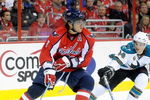 WASHINGTON - OCTOBER 15:  Alex Ovechkin #8 of the Washington Capitals handles the puck against Marc-Edouard Vlasic #44 of the San Jose Sharks at the Verizon Center on October 15, 2009 in Washington, DC.  (Photo by Greg Fiume/Getty Images)