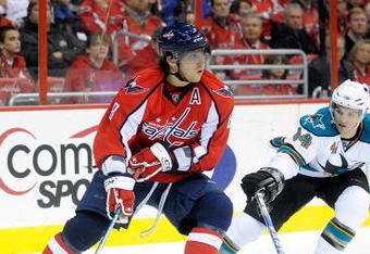 WASHINGTON - OCTOBER 15:  Alex Ovechkin #8 of the Washington Capitals handles the puck against Marc-Edouard Vlasic #44 of the San Jose Sharks at the Verizon Center on October 15, 2009 in Washington, DC.  (Photo by Greg Fiume/Getty Images)