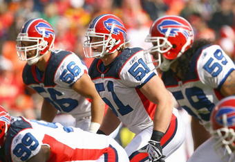 KANSAS CITY, MO - NOVEMBER 23:  Keith Ellison #56, Paul Posluszny #51 and Kawika Mitchell #59of the Buffalo Bills get ready on the line of scrimmage during the game against the Kansas City Chiefs on November 23, 2008 at Arrowhead Stadium in Kansas City, Missouri. (Photo by Jamie Squire/Getty Images)
