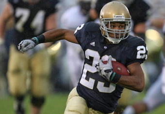 SOUTH BEND, IN - OCTOBER 03: Golden Tate #23 of the Notre Dame Fighting Irish runs against the Washington Huskies on his way to a 67 yard touchdown on October 3, 2009 at Notre Dame Stadium in South Bend, Indiana. (Photo by Jonathan Daniel/Getty Images)