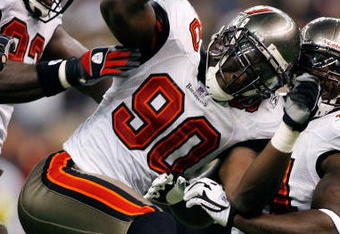 NEW ORLEANS - DECEMBER 02:  Gaines Adams #90 of the Tampa Bay Buccaneers celebrates after sacking quarterback Drew Brees #9 of the New Orleans Saints on December 2, 2007 at the Louisiana Superdome in New Orleans, Louisiana. The Buccaneers defeated the Saints 27-23.  (Photo by Chris Graythen/Getty Images)