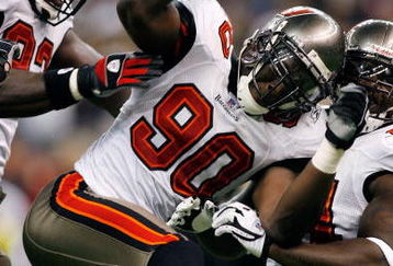 NEW ORLEANS - DECEMBER 02:  Gaines Adams #90 of the Tampa Bay Buccaneers celebrates after sacking quarterback Drew Brees #9 of the New Orleans Saints on December 2, 2007 at the Louisiana Superdome in New Orleans, Louisiana. The Buccaneers defeated the Saints 27-23.  (Photo by Chris Graythen/Getty Images)