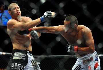 LAS VEGAS - JULY 11:  (R-L) Dan Henderson connects with a right to Mike Bisping during their middleweight bout during UFC 100 on July 11, 2009 in Las Vegas, Nevada.  (Photo by Jon Kopaloff/Getty Images)