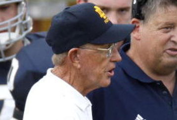 SOUTH BEND, IN - SEPTEMBER 13: Former head coach Lou Holtz of the Notre Dame Fighting Irish talks to current head coach Charlie Weis prior to playing the Michigan Wolverines on September 13, 2008 at Notre Dame Stadium in South Bend, Indiana.  (Photo by Gregory Shamus/Getty Images)