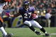 BALTIMORE - OCTOBER 11:  Ray Rice #27 of the Baltimore Ravens runs the ball against the Cincinnati Bengals at M&T Bank Stadium on October 11, 2009 in Baltimore, Maryland. The Bengals defeated the Ravens 17-14. (Photo by Larry French/Getty Images)