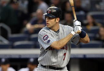 NEW YORK - OCTOBER 09:  Joe Mauer #7 of the Minnesota Twins bats against the New York Yankees in Game Two of the ALDS during the 2009 MLB Playoffs at Yankee Stadium on October 9, 2009 in the Bronx borough of New York City.  (Photo by Jim McIsaac/Getty Images)