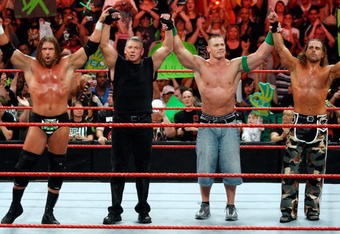 LAS VEGAS - AUGUST 24:  (L-R) Wrestler Triple H, World Wrestling Entertainment Inc. Chairman Vince McMahon, and wrestlers John Cena and Shawn Michaels pose in the ring during the WWE Monday Night Raw show at the Thomas & Mack Center August 24, 2009 in Las Vegas, Nevada.  (Photo by Ethan Miller/Getty Images)