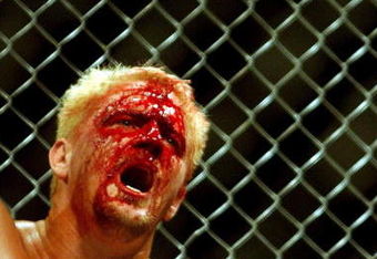 26 Oct 2001:  Jeff Jarrett feels the pain during the cage fight bout during the WWA Wrestling 'Inception'  fight night held at the Sydney Superdome, Sydney, Australia.  DIGITAL IMAGE Mandatory Credit: Chris McGrath/ALLSPORT