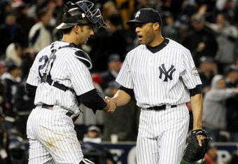 NEW YORK - OCTOBER 16:  Mariano Rivera #42 of the New York Yankees shakes hands with Jorge Posada #20 after defeating the Los Angeles Angels of Anaheim 4-1 in the ninth inning of Game One of the ALCS during the 2009 MLB Playoffs at Yankee Stadium on October 16, 2009 in New York, New York.  (Photo by Jim McIsaac/Getty Images)