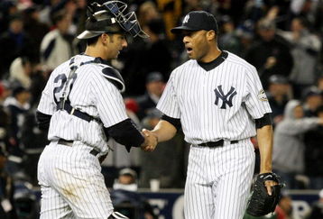 NEW YORK - OCTOBER 16:  Mariano Rivera #42 of the New York Yankees shakes hands with Jorge Posada #20 after defeating the Los Angeles Angels of Anaheim 4-1 in the ninth inning of Game One of the ALCS during the 2009 MLB Playoffs at Yankee Stadium on October 16, 2009 in New York, New York.  (Photo by Jim McIsaac/Getty Images)