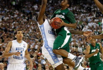 DETROIT - APRIL 06:  Kalin Lucas #1 of the Michigan State Spartans goes up for a shot against Deon Thompson #21 of the North Carolina Tar Heels in the first half during the 2009 NCAA Division I Men's Basketball National Championship game at Ford Field on April 6, 2009 in Detroit, Michigan.  (Photo by Streeter Lecka/Getty Images)