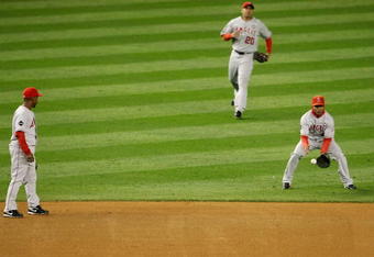 NEW YORK - OCTOBER 16:  Erick Aybar #2 of the Los Angeles Angels of Anaheim (R) lets a fly ball drop while Juan Rivera #20 (C) and Chone Figgins #9 (L) look on in the first inning of Game One of the ALCS during the 2009 MLB Playoffs at Yankee Stadium on October 16, 2009 in New York, New York.  (Photo by Nick Laham/Getty Images)